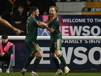 James Brophy (7, Cambridge United) celebrates after scoring the team's first goal during the FA Cup First Round match between Woking and Cam...