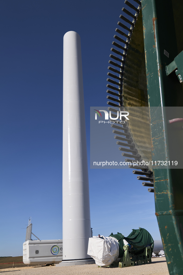 A large crane assembles a wind turbine in the rolling hills of Castelluccio dei Sauri, Foggia, Italy, on November 1, 2024. This wind farm ex...