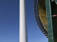 A large crane assembles a wind turbine in the rolling hills of Castelluccio dei Sauri, Foggia, Italy, on November 1, 2024. This wind farm ex...