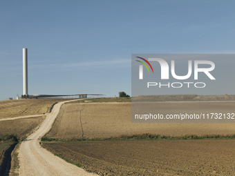 A large crane assembles a wind turbine in the rolling hills of Castelluccio dei Sauri, Foggia, Italy, on November 1, 2024. This wind farm ex...