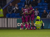 Christian Doidge #9 of Forest Green Rovers F.C. celebrates his goal with teammates during the FA Cup First Round match between Stockport Cou...