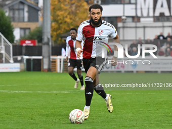 Deon Moore (14 Woking) controls the ball during the FA Cup First Round match between Woking and Cambridge United at the Kingfield Stadium in...