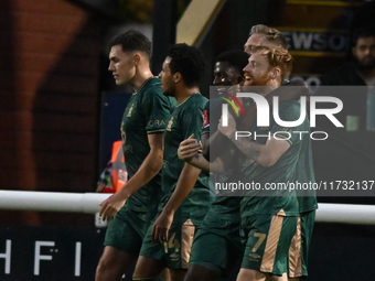 James Brophy (7, Cambridge United) celebrates after scoring the team's first goal during the FA Cup First Round match between Woking and Cam...