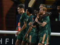 James Brophy (7, Cambridge United) celebrates after scoring the team's first goal during the FA Cup First Round match between Woking and Cam...