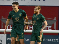 James Brophy (7, Cambridge United) celebrates after scoring the team's first goal during the FA Cup First Round match between Woking and Cam...