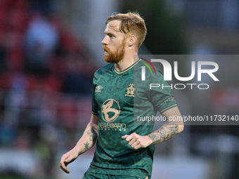 James Brophy (7 Cambridge United) participates in the FA Cup First Round match between Woking and Cambridge United at the Kingfield Stadium...