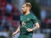 James Brophy (7 Cambridge United) participates in the FA Cup First Round match between Woking and Cambridge United at the Kingfield Stadium...