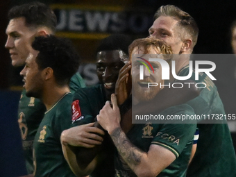 James Brophy (7, Cambridge United) celebrates after scoring the team's first goal during the FA Cup First Round match between Woking and Cam...