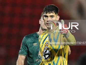 Goalkeeper Vincente Reyes of Cambridge United stands after the final whistle during the FA Cup First Round match between Woking and Cambridg...