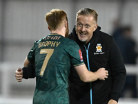 Manager Garry Monk of Cambridge United congratulates James Brophy, number 7 of Cambridge United, after the final whistle during the FA Cup F...