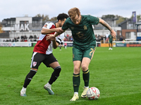 James Brophy (7, Cambridge United) controls the ball during the FA Cup First Round match between Woking and Cambridge United at the Kingfiel...