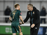 James Brophy of Cambridge United receives congratulations from Manager Garry Monk of Cambridge United after the final whistle during the FA...