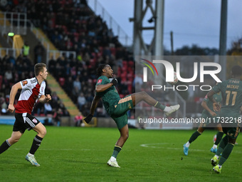 Dan Nlundulu (9 Cambridge United) controls the ball during the FA Cup First Round match between Woking and Cambridge United at the Kingfield...