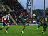 Dan Nlundulu (9 Cambridge United) controls the ball during the FA Cup First Round match between Woking and Cambridge United at the Kingfield...