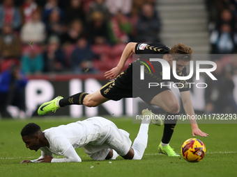 Jack Rudoni of Coventry City fouls Isaiah Jones of Middlesbrough during the Sky Bet Championship match between Middlesbrough and Coventry Ci...