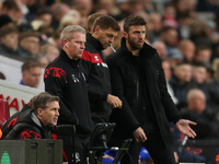 Middlesbrough Coach Grant Leadbitter, Middlesbrough Coach Johnathan Woodgate, and Middlesbrough Head Coach Michael Carrick discuss during th...