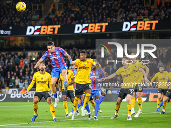 Number 12, Daniel Munoz of Crystal Palace (second from left), heads the ball during the Premier League match between Wolverhampton Wanderers...