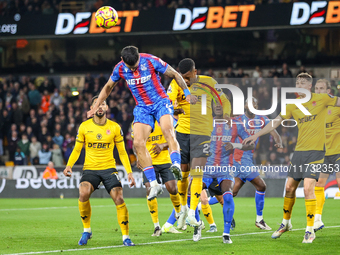 Number 12, Daniel Munoz of Crystal Palace (second from left), heads the ball during the Premier League match between Wolverhampton Wanderers...