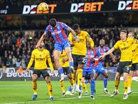 Number 12, Daniel Munoz of Crystal Palace (second from left), heads the ball during the Premier League match between Wolverhampton Wanderers...