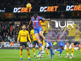 Number 12, Daniel Munoz of Crystal Palace (second from left), heads the ball during the Premier League match between Wolverhampton Wanderers...