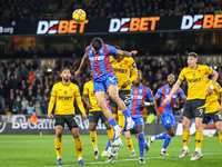 Number 12, Daniel Munoz of Crystal Palace (second from left), heads the ball during the Premier League match between Wolverhampton Wanderers...