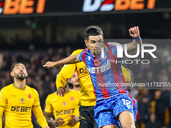 Number 12, Daniel Munoz of Crystal Palace, is in action in the air during the Premier League match between Wolverhampton Wanderers and Cryst...