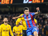 Number 12, Daniel Munoz of Crystal Palace, is in action in the air during the Premier League match between Wolverhampton Wanderers and Cryst...