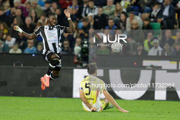 Jordan Zemura of Udinese is hindered by Manuel Locatelli of Juventus during the Italian Serie A Enilive soccer championship match between Ud...