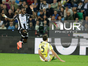 Jordan Zemura of Udinese is hindered by Manuel Locatelli of Juventus during the Italian Serie A Enilive soccer championship match between Ud...