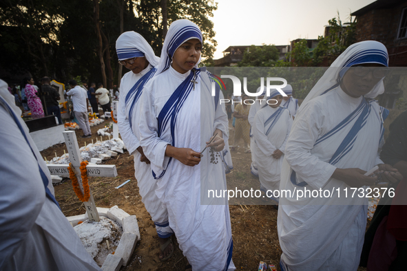 Nuns offer prayers on the grave during the All Souls' Day observation in Guwahati, India, on November 2, 2024. All Souls' Day is a Christian...