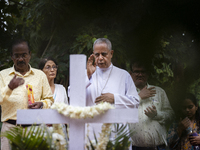 People from the Christian community light candles and offer prayers on the grave of their relative during the All Souls' Day observation in...