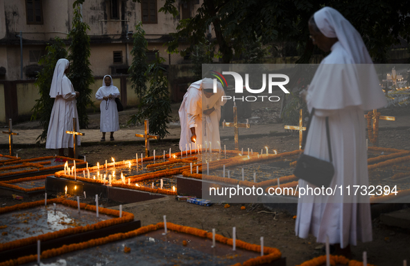 Nuns offer prayers on the grave during the All Souls' Day observation in Guwahati, India, on November 2, 2024. All Souls' Day is a Christian...