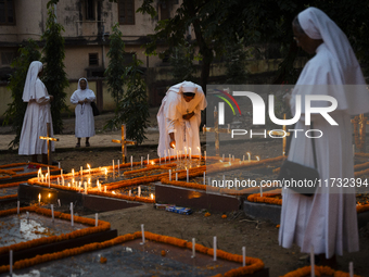 Nuns offer prayers on the grave during the All Souls' Day observation in Guwahati, India, on November 2, 2024. All Souls' Day is a Christian...