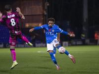 Odin Bailey, number 27 of Stockport County F.C., takes a shot at goal during the FA Cup First Round match between Stockport County and Fores...