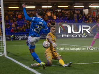 Jamie Searle #20 (GK) of Forest Green Rovers F.C. makes a save from Ryan Rydel #23 of Stockport County F.C. during the FA Cup First Round ma...