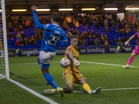 Jamie Searle #20 (GK) of Forest Green Rovers F.C. makes a save from Ryan Rydel #23 of Stockport County F.C. during the FA Cup First Round ma...