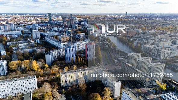 A drone captures a view of the city from Holzmarkt towards Warschauer Brucke with the headquarters of the BVG (corner down left) in Berlin,...