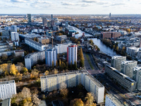 A drone captures a view of the city from Holzmarkt towards Warschauer Brucke with the headquarters of the BVG (corner down left) in Berlin,...