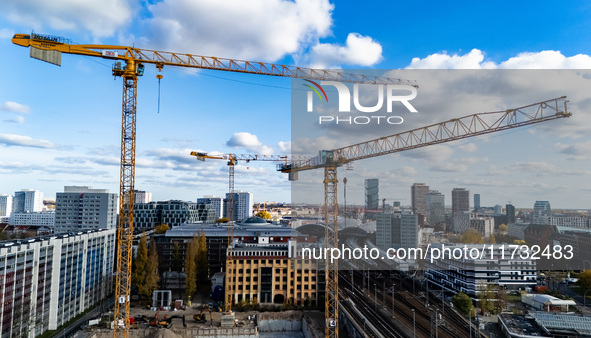 A drone captures a view of a construction site and cranes in the area of Holzmarktstrasse in Berlin, Germany, on November 2, 2024. 