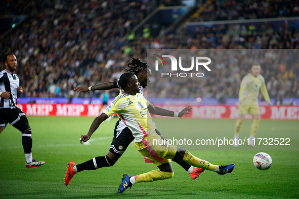 Timothy Weah of Juventus plays against Kingsley Ehizibue of Udinese during the Italian Serie A Enilive soccer championship match between Udi...