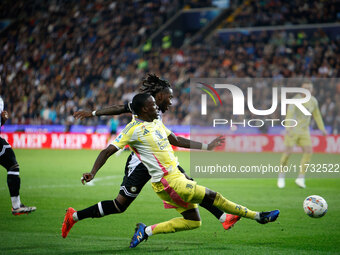 Timothy Weah of Juventus plays against Kingsley Ehizibue of Udinese during the Italian Serie A Enilive soccer championship match between Udi...