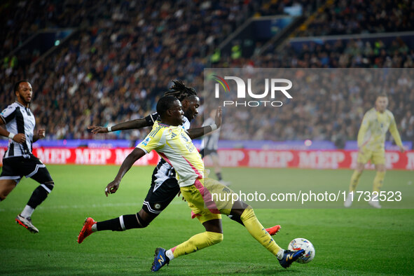 Timothy Weah of Juventus plays against Kingsley Ehizibue of Udinese during the Italian Serie A Enilive soccer championship match between Udi...