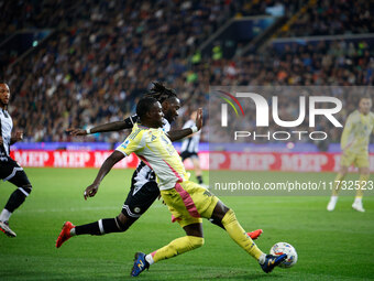 Timothy Weah of Juventus plays against Kingsley Ehizibue of Udinese during the Italian Serie A Enilive soccer championship match between Udi...