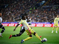 Timothy Weah of Juventus plays against Kingsley Ehizibue of Udinese during the Italian Serie A Enilive soccer championship match between Udi...