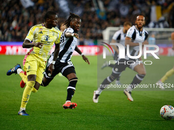 Timothy Weah of Juventus plays against Kingsley Ehizibue of Udinese during the Italian Serie A Enilive soccer championship match between Udi...