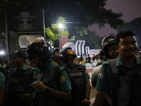 Law enforcers escort a minority protest as they demand protections for Hindus and other minorities in Dhaka, Bangladesh, on November 2, 2024...