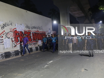 Law enforcers escort a minority protest as they demand protections for Hindus and other minorities in Dhaka, Bangladesh, on November 2, 2024...