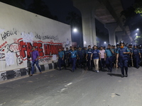 Law enforcers escort a minority protest as they demand protections for Hindus and other minorities in Dhaka, Bangladesh, on November 2, 2024...