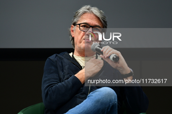 Alain Marschall and Olivier Truchot attend the first book fair in Valence, Drome, on November 2, 2024. 