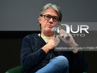 Alain Marschall and Olivier Truchot attend the first book fair in Valence, Drome, on November 2, 2024. (